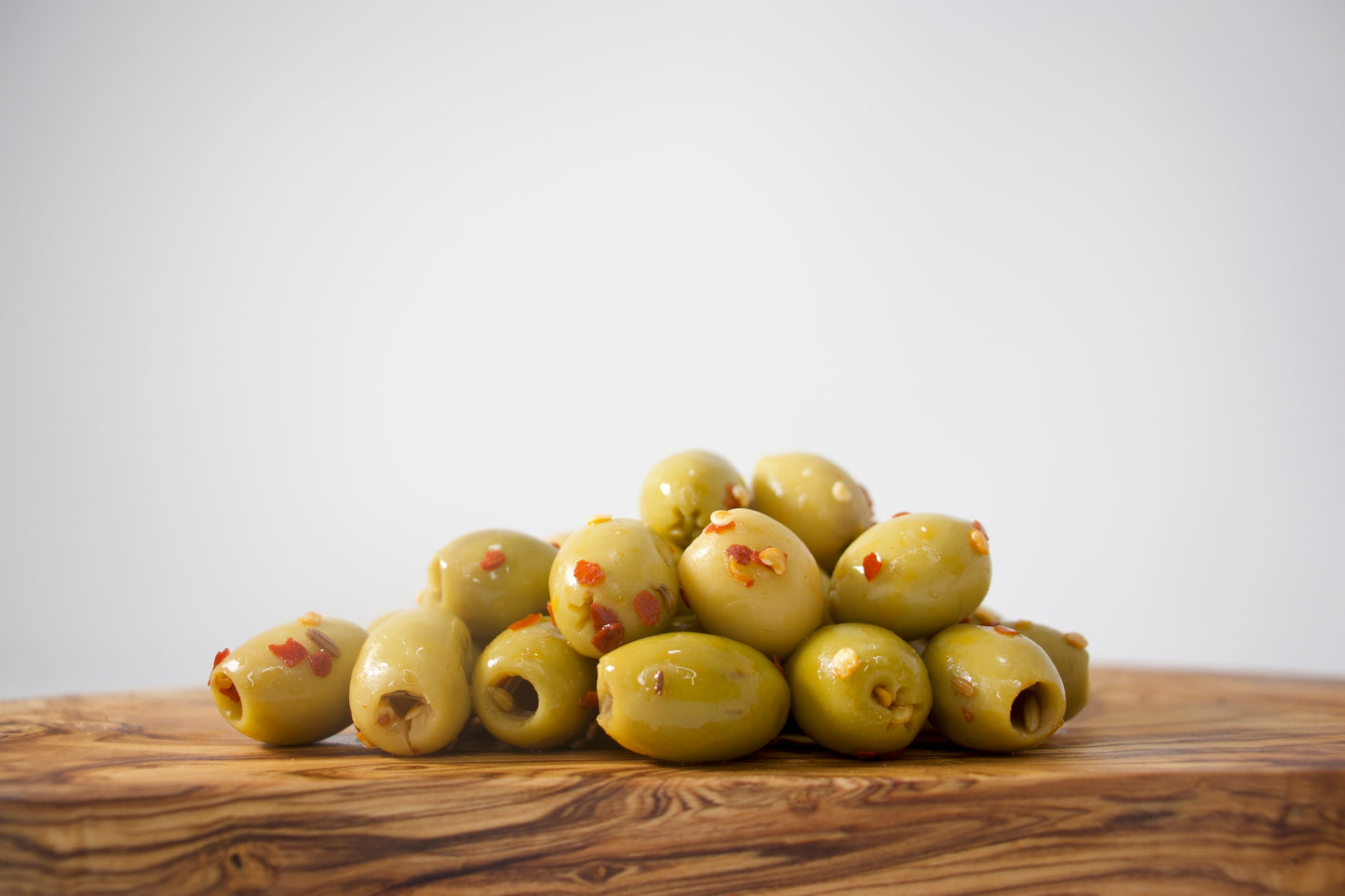 OLIVES VERTES MARINÉES DÉNOYAUTÉES CALABRESE OLIVE PRESSÉE / OLIVE PRESSÉE MARINATED PITTED GREEN OLIVES CALABRESE